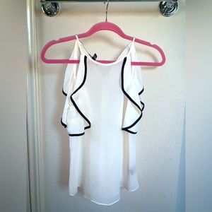 Small white blouse with black lining on cold shoulder sleeves